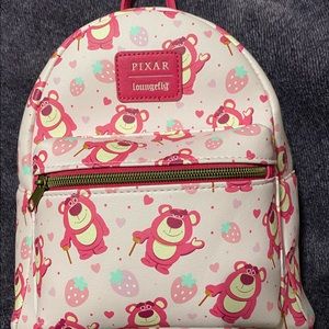 Adorable all over print Lotso Loungefly mini backpack.